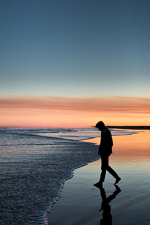 silhouette of person walking on beach during sunset – Human, alone man beach HD phone wallpaper